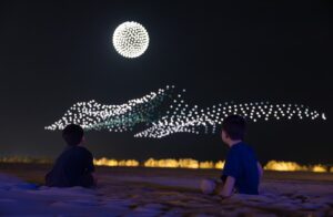 Manar Abu Dhabi 2025 Tracing Light Across a Moving Desert: Manar Abu Dhabi 2025 Image © Image courtesy of Department of Culture and Tourism Abu Dhabi & Public Art Abu Dhabi Iregular - " As Water Falls Encor Studio - " Alcove Ltd" KAWS - " Holiday Abu Dhabi" Maitha Hamdan - "Breath of the Same Place" Shaikha Al Mazrou - "Contingent Object" Lachlan Turczan - "Veil I" DRIFT - "Whispers" Ezequiel Pini (A.K.A. SIX N. FIVE) - "Skyward" DRIFT - "Unfold" DRIFT - "Wind of Change" Designooor Hamed Mahzoon