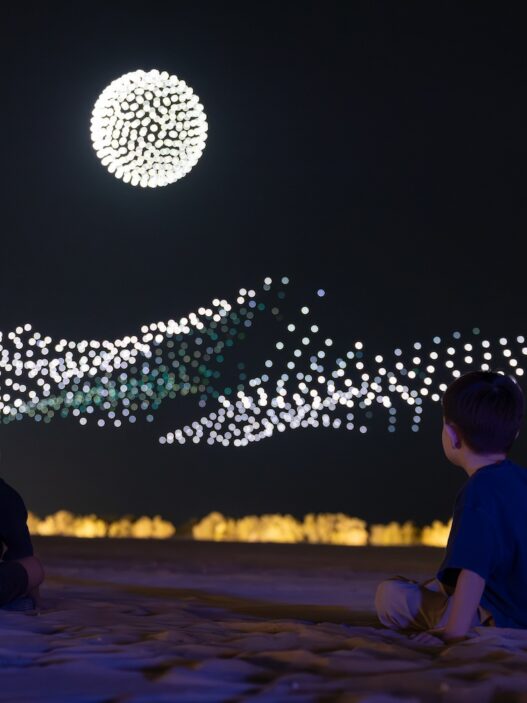 Manar Abu Dhabi 2025 Tracing Light Across a Moving Desert: Manar Abu Dhabi 2025 Image © Image courtesy of Department of Culture and Tourism Abu Dhabi & Public Art Abu Dhabi Iregular - " As Water Falls Encor Studio - " Alcove Ltd" KAWS - " Holiday Abu Dhabi" Maitha Hamdan - "Breath of the Same Place" Shaikha Al Mazrou - "Contingent Object" Lachlan Turczan - "Veil I" DRIFT - "Whispers" Ezequiel Pini (A.K.A. SIX N. FIVE) - "Skyward" DRIFT - "Unfold" DRIFT - "Wind of Change" Designooor Hamed Mahzoon
